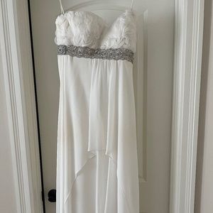 White fancy dress with feathers